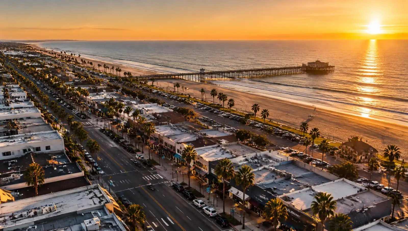 Illustrative image of a coastal main street and pier at sunset